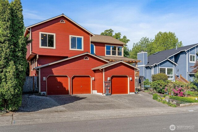 16515 126th Ave NE, Woodinville, WA 98072 - view of front of house with a garage and asphalt driveway