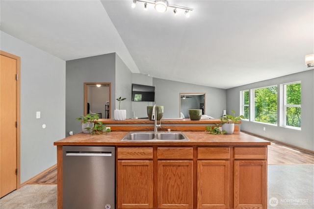 138 Stamper Rd, Elma, WA 98541 - kitchen with stainless steel dishwasher, a sink, open floor plan, lofted ceiling, and light countertops