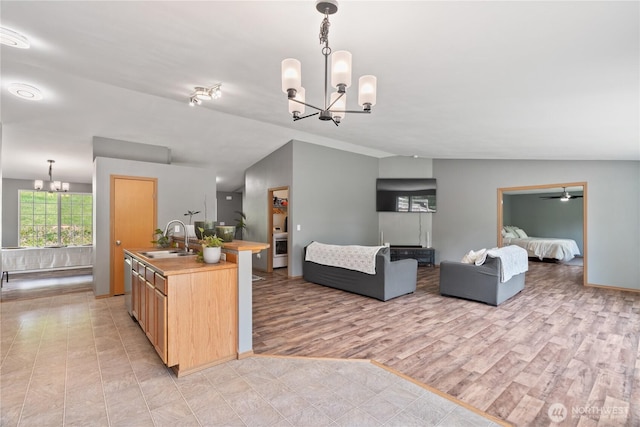 138 Stamper Rd, Elma, WA 98541 - kitchen featuring a chandelier, a sink, light brown cabinets, stainless steel dishwasher, and open floor plan