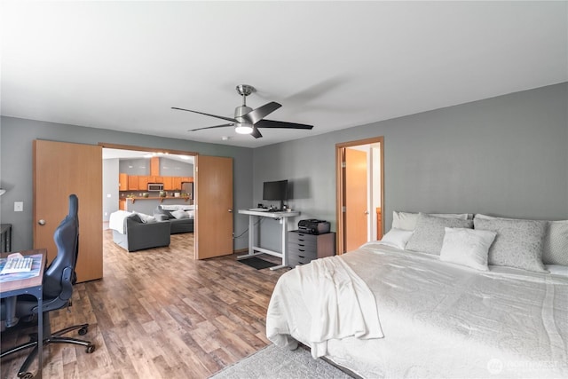 138 Stamper Rd, Elma, WA 98541 - bedroom with wood finished floors, a desk, and a ceiling fan