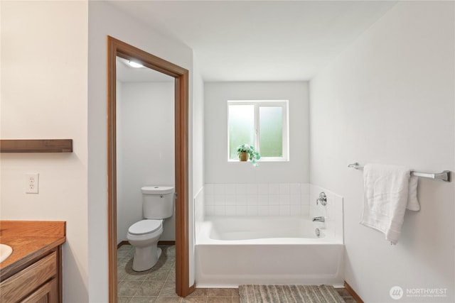 138 Stamper Rd, Elma, WA 98541 - full bath featuring a garden tub, vanity, toilet, baseboards, and tile patterned floors