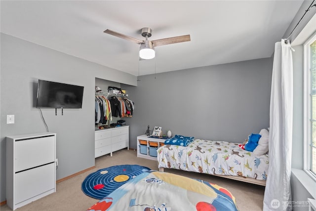 138 Stamper Rd, Elma, WA 98541 - carpeted bedroom featuring ceiling fan, a closet, and baseboards