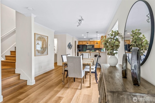 10309 Midvale Ave N Unit B, Seattle, WA 98133 - dining space with light wood-style flooring, stairway, crown molding, baseboards, and recessed lighting