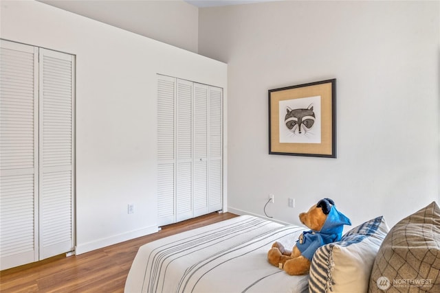 10309 Midvale Ave N Unit B, Seattle, WA 98133 - bedroom featuring wood finished floors, multiple closets, and baseboards