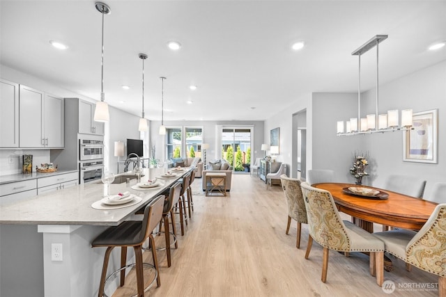 29215 217th Ct SE, Black Diamond, WA 98010 - dining room featuring light wood-style flooring and recessed lighting