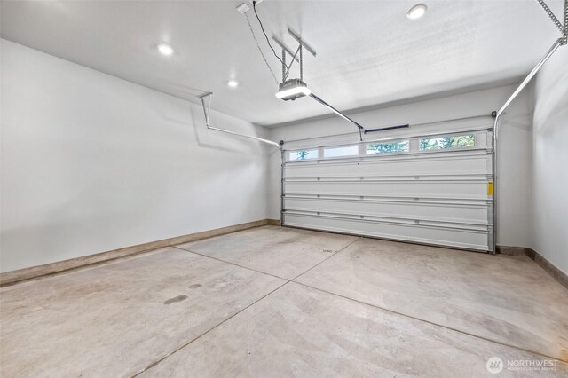 29215 217th Ct SE, Black Diamond, WA 98010 - garage with baseboards, recessed lighting, and a garage door opener