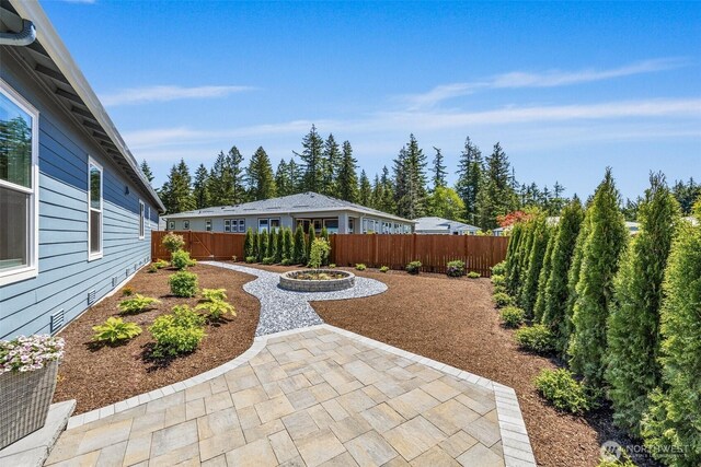 29215 217th Ct SE, Black Diamond, WA 98010 - fenced backyard with a patio area