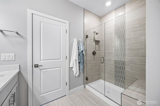 29215 217th Ct SE, Black Diamond, WA 98010 - bathroom featuring a shower stall, vanity, baseboards, and recessed lighting