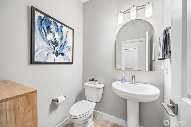 29215 217th Ct SE, Black Diamond, WA 98010 - half bath with toilet, baseboards, and wood finished floors