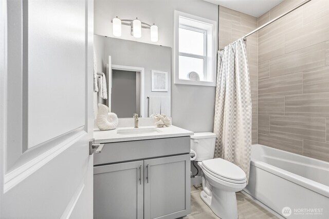 29215 217th Ct SE, Black Diamond, WA 98010 - bathroom featuring vanity, toilet, and shower / bath combination with curtain