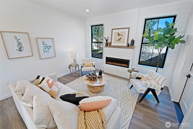 3906 Crosswinds Ct, Anacortes, WA 98221 - living room featuring a large fireplace, baseboards, recessed lighting, and dark wood-style floors