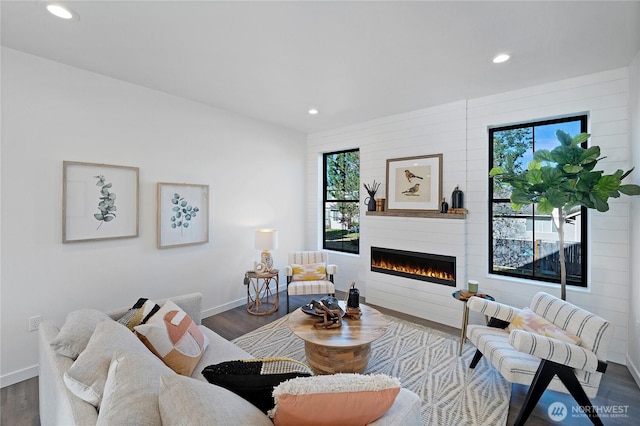 3906 Crosswinds Ct, Anacortes, WA 98221 - living room featuring recessed lighting, a fireplace, baseboards, and dark wood finished floors
