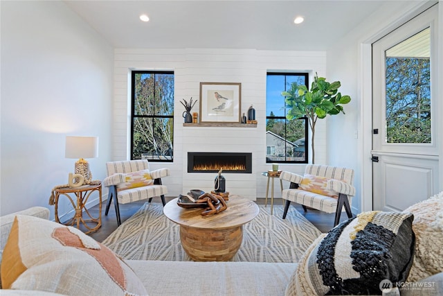 3906 Crosswinds Ct, Anacortes, WA 98221 - living room with wood finished floors, a fireplace, and recessed lighting