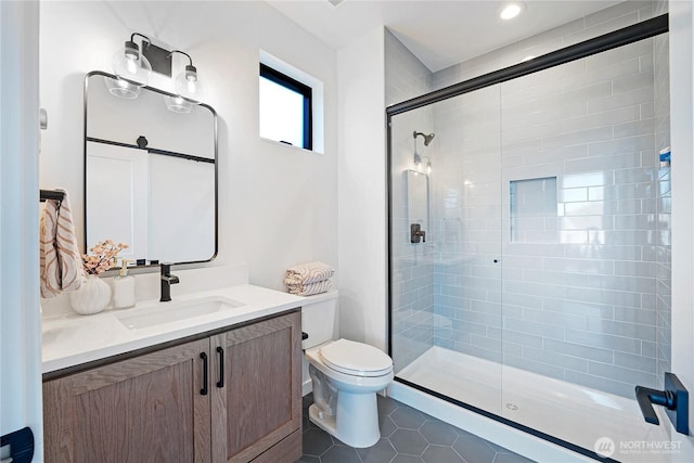 3906 Crosswinds Ct, Anacortes, WA 98221 - bathroom with vanity, a stall shower, tile patterned floors, and toilet