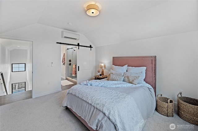 3906 Crosswinds Ct, Anacortes, WA 98221 - bedroom with a wall unit AC, a barn door, lofted ceiling, carpet, and baseboards