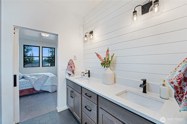 3906 Crosswinds Ct, Anacortes, WA 98221 - bathroom featuring double vanity, tile patterned floors, ensuite bathroom, and wooden walls
