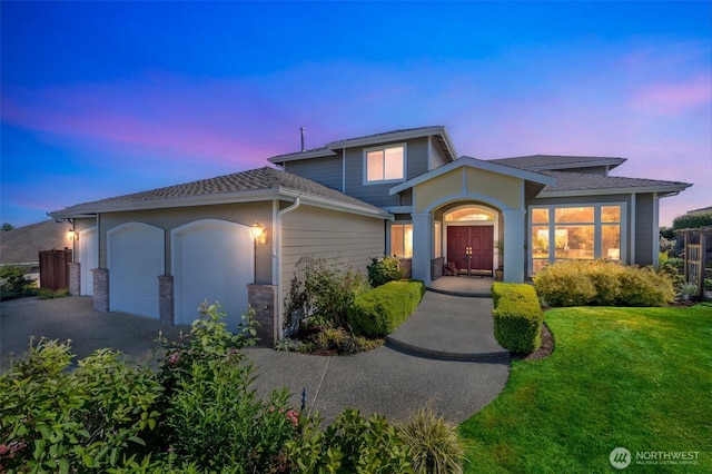 1875 Parkview Dr NE, Tacoma, WA 98422 - traditional-style house with driveway, a garage, a yard, and roof with shingles