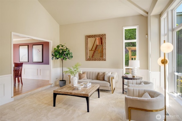 1875 Parkview Dr NE, Tacoma, WA 98422 - living room featuring wainscoting, light carpet, a decorative wall, and vaulted ceiling