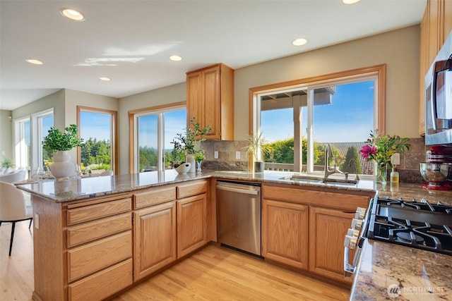 1875 Parkview Dr NE, Tacoma, WA 98422 - kitchen with stainless steel appliances, a sink, tasteful backsplash, recessed lighting, and light stone countertops