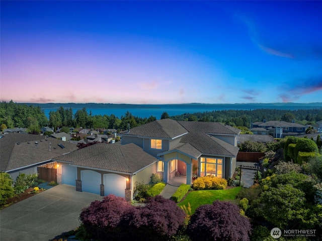 1875 Parkview Dr NE, Tacoma, WA 98422 - traditional-style house featuring an attached garage, concrete driveway, and a water view
