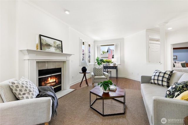 7417 53rd Street Ct W, University Place, WA 98467 - living area featuring a tile fireplace, wood finished floors, baseboards, recessed lighting, and decorative columns