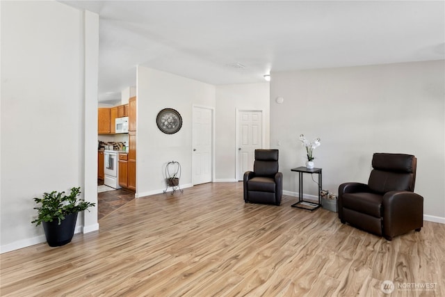 300 SW 7th Ave Unit 127, Battle Ground, WA 98604 - sitting room featuring light wood-style flooring and baseboards