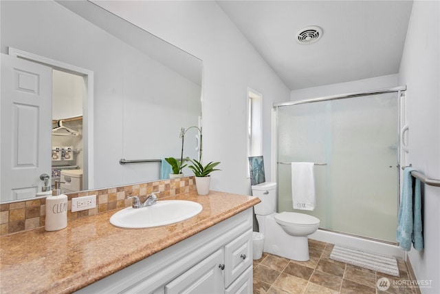 300 SW 7th Ave Unit 127, Battle Ground, WA 98604 - bathroom with a stall shower, vanity, and decorative backsplash