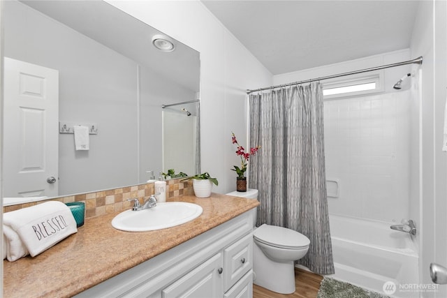 300 SW 7th Ave Unit 127, Battle Ground, WA 98604 - bathroom with vanity, shower / bath combo with shower curtain, vaulted ceiling, and wood finished floors