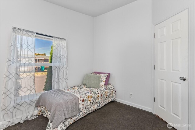 300 SW 7th Ave Unit 127, Battle Ground, WA 98604 - bedroom featuring dark colored carpet and baseboards