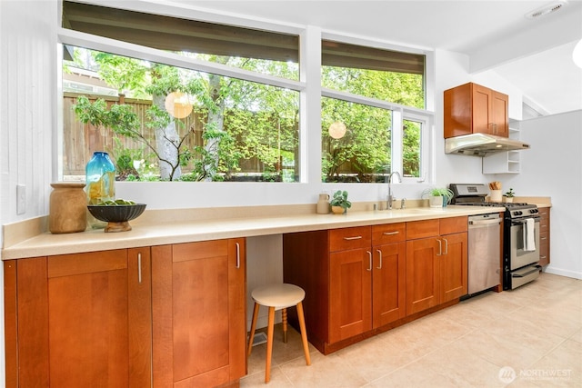 5 Wembley Ln, Mercer Island, WA 98040 - kitchen featuring stainless steel range with gas stovetop, dishwashing machine, a sink, light tile patterned floors, and light countertops