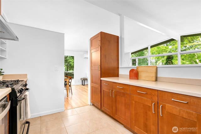 5 Wembley Ln, Mercer Island, WA 98040 - kitchen featuring black gas range oven, brown cabinetry, and light countertops