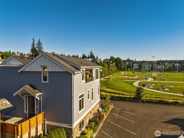 656 Daley St Unit 102, Edmonds, WA 98020 - view of side of property with a yard and stone siding