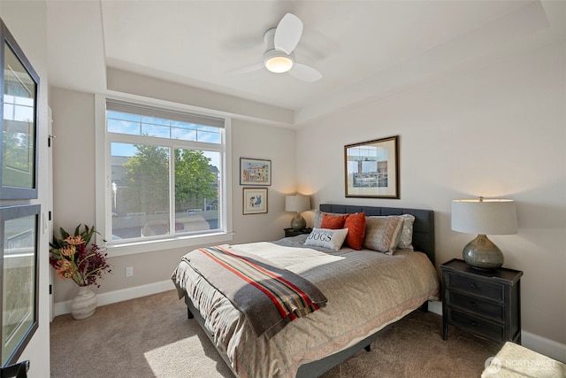 656 Daley St Unit 102, Edmonds, WA 98020 - carpeted bedroom with baseboards, ceiling fan, and a tray ceiling