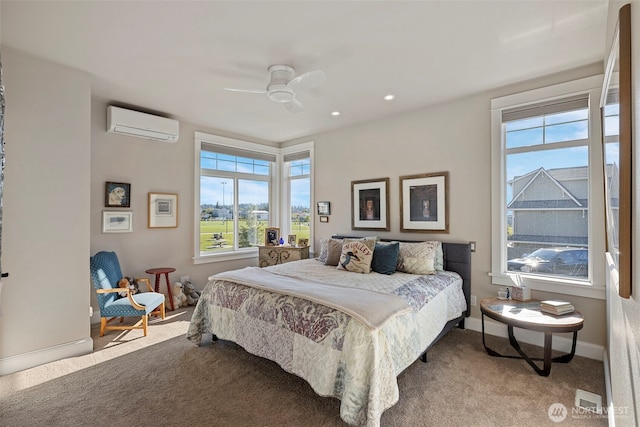 656 Daley St Unit 102, Edmonds, WA 98020 - carpeted bedroom featuring an AC wall unit, multiple windows, baseboards, ceiling fan, and recessed lighting