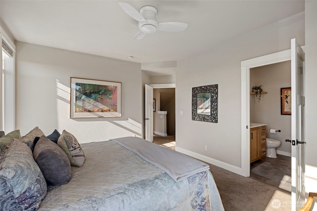 656 Daley St Unit 102, Edmonds, WA 98020 - carpeted bedroom with connected bathroom, baseboards, and ceiling fan