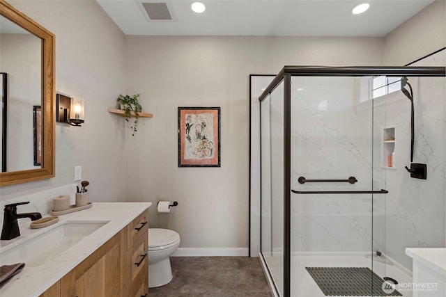 656 Daley St Unit 102, Edmonds, WA 98020 - bathroom with vanity, toilet, a marble finish shower, and recessed lighting