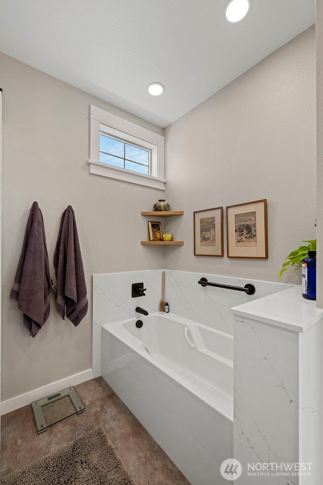 656 Daley St Unit 102, Edmonds, WA 98020 - bathroom with a bath, baseboards, and recessed lighting