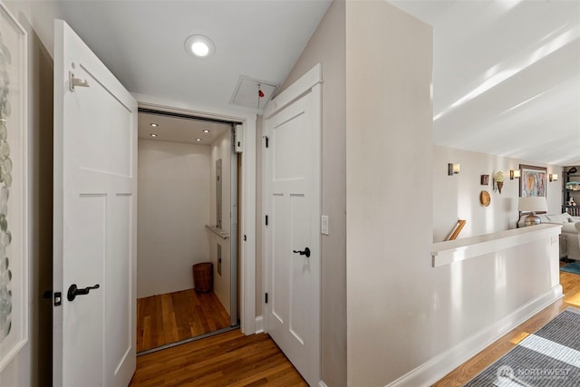 656 Daley St Unit 102, Edmonds, WA 98020 - corridor with wood finished floors, an upstairs landing, and recessed lighting