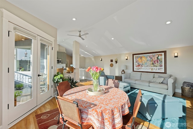 656 Daley St Unit 102, Edmonds, WA 98020 - dining room featuring lofted ceiling, french doors, light wood finished floors, a ceiling fan, and baseboards