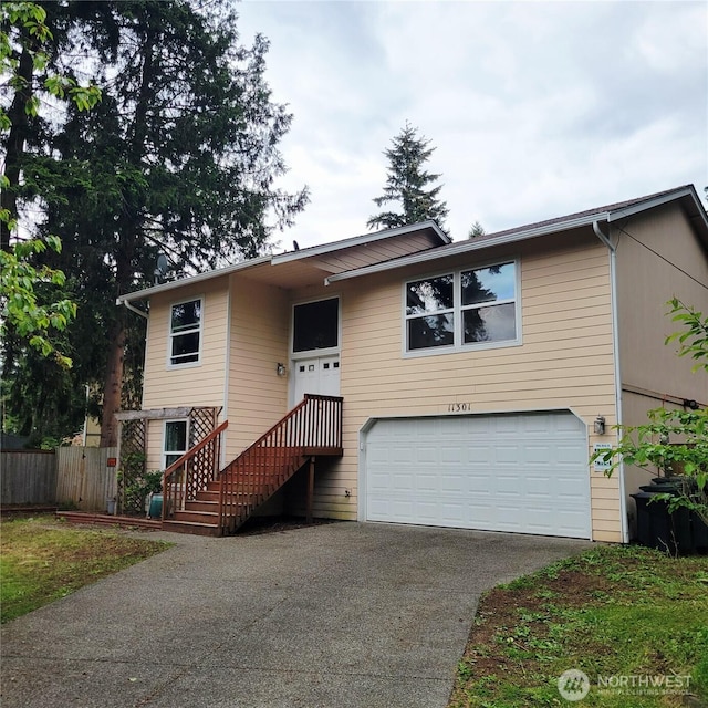 11301 199th Ave E, Bonney Lake, WA 98391 - view of front of property featuring asphalt driveway and a garage