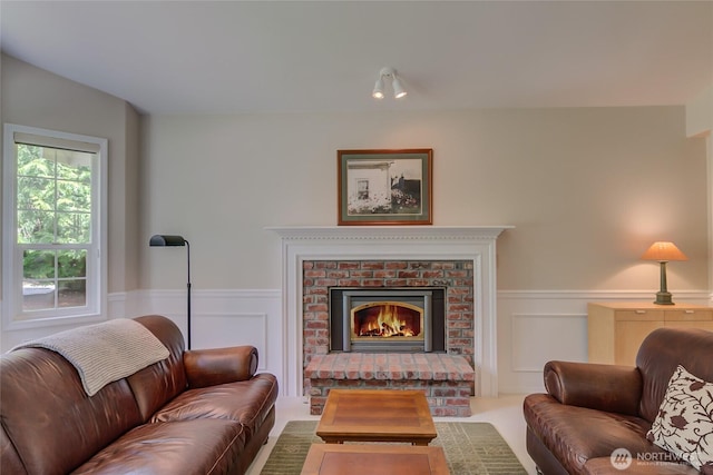 18915 SE 284th Ct, Kent, WA 98042 - living area with wainscoting, a fireplace, and a decorative wall
