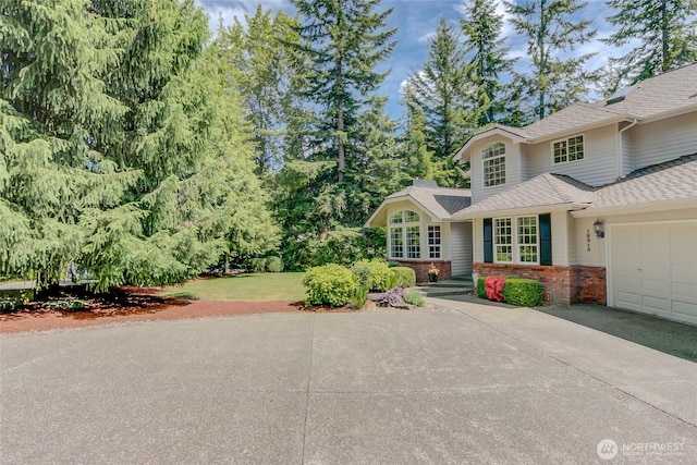 18915 SE 284th Ct, Kent, WA 98042 - view of front of home with brick siding, driveway, an attached garage, and a shingled roof