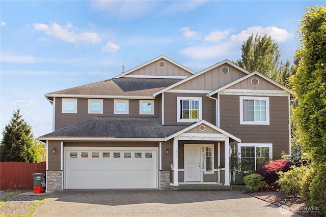 1875 Mckinley St, Ferndale, WA 98248 - view of front of property with asphalt driveway, board and batten siding, a shingled roof, stone siding, and a garage