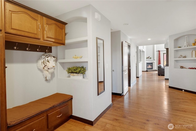 1875 Mckinley St, Ferndale, WA 98248 - mudroom featuring light wood-type flooring, baseboards, a warm lit fireplace, built in features, and recessed lighting