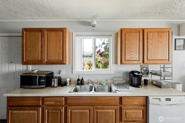 260 Baltimore St, Longview, WA 98632 - kitchen featuring stainless steel microwave, a sink, white dishwasher, a textured ceiling, and light countertops