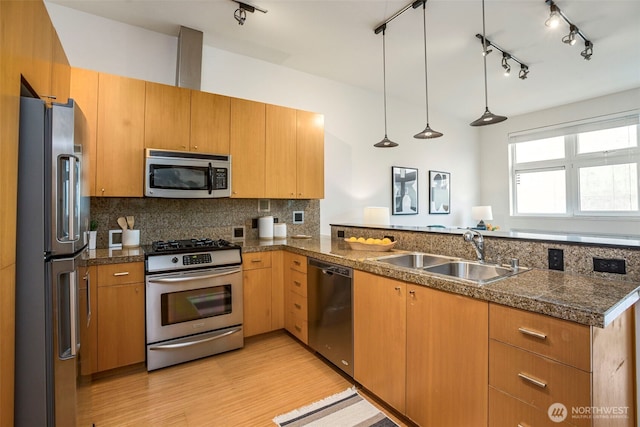 17 W Mercer St Unit 218, Seattle, WA 98119 - kitchen featuring stainless steel appliances, a sink, tile countertops, light wood-style flooring, and a peninsula