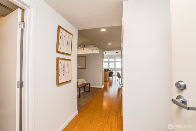 17 W Mercer St Unit 218, Seattle, WA 98119 - corridor with light wood finished floors, baseboards, and recessed lighting
