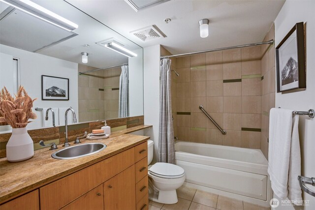 17 W Mercer St Unit 218, Seattle, WA 98119 - bathroom featuring tile patterned flooring, shower / bath combination with curtain, vanity, and toilet