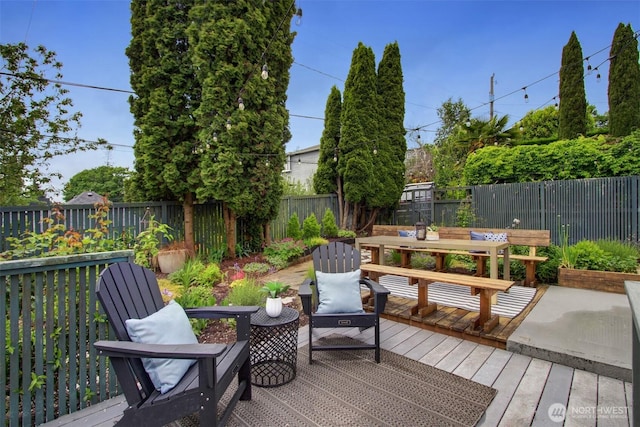 2433 E Valley St, Seattle, WA 98112 - wooden deck featuring a fenced backyard and outdoor dining space