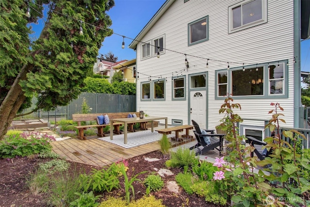 2433 E Valley St, Seattle, WA 98112 - rear view of property featuring a wooden deck and outdoor dining area